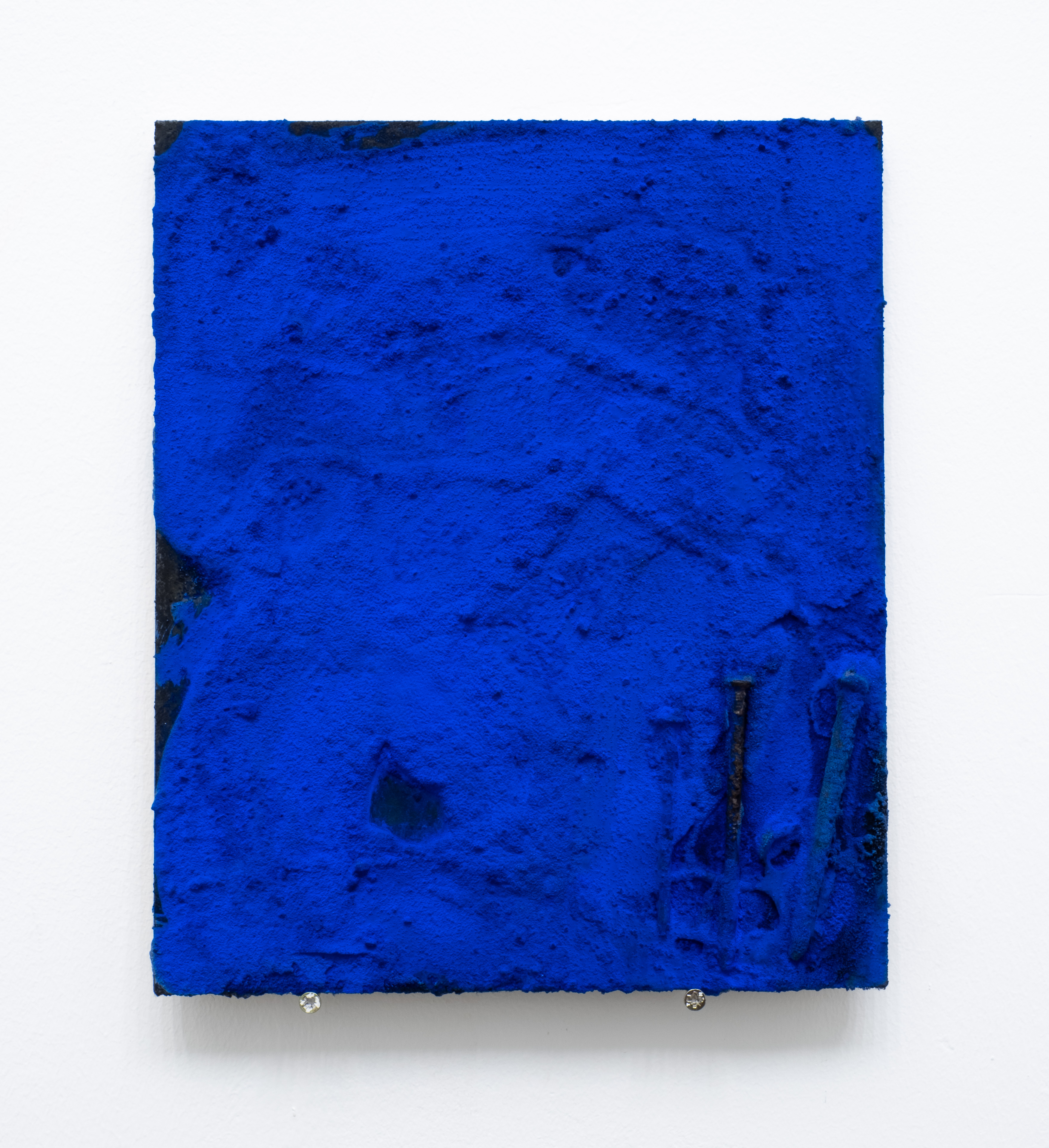 <b>Title: </b>La sombra del azul<br /><b>Year: </b>2021<br /><b>Medium: </b>Salt, wood glue, rusted nails, ink, and pigment on wood<br /><b>Size: </b>22 x 34 cm
